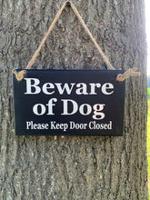 Load image into Gallery viewer, Enhance your home's safety and charm with our Beware of Dogs, Please Keep Door Closed wood sign. Crafted from high-quality materials, this sign is perfect for your porch, door, or wall, ensuring your pets stay safe and your home looks inviting