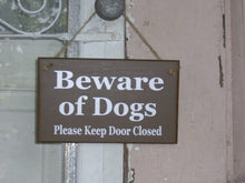 Load image into Gallery viewer, Enhance your home's safety and charm with our Beware of Dogs, Please Keep Door Closed wood sign. Crafted from high-quality materials, this sign is perfect for your porch, door, or wall, ensuring your pets stay safe and your home looks inviting