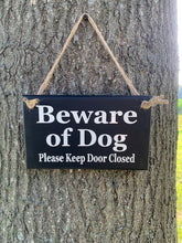 Load image into Gallery viewer, Enhance your home&#39;s safety and charm with our Beware of Dogs, Please Keep Door Closed wood sign. Crafted from high-quality materials, this sign is perfect for your porch, door, or wall, ensuring your pets stay safe and your home looks inviting