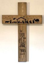 Load image into Gallery viewer, Christmas Wooden Cross with Nativity Wall Hanging by Heartfelt Giver offers a meaningful touch to your holiday decor. Handcrafted from wood and stained brown, this wall hanging features a black silhouette of a classic nativity scene with the phrase “For unto us a child is born”. Hang it in any interior room, or on a sheltered porch for an extra special accent piece.