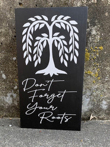 The Don't Forget Your Roots Sign is a beautifully crafted wall hanging made from natural wood, accented with a sleek black finish. Remind yourself to stay grounded with this stylish and meaningful addition to your home decor. 