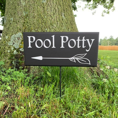 Pool Sign for Outdoor Pools that provides direction for your guests to follow to the bathroom that you designate. 