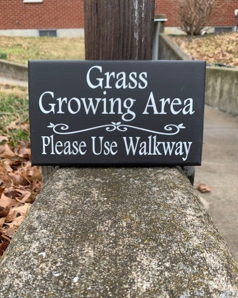 walkway sign keep off grass 